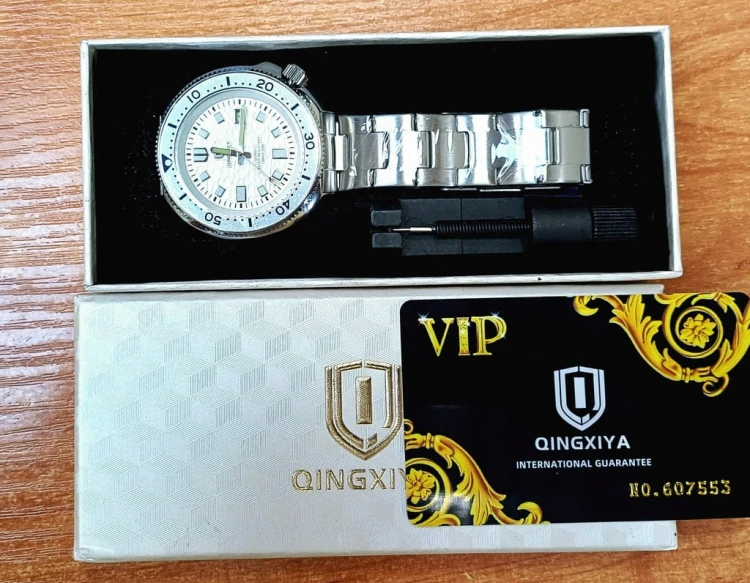 Masywny zegarek luminous na bransolecie, datownik, obrotowy pierścień, stal